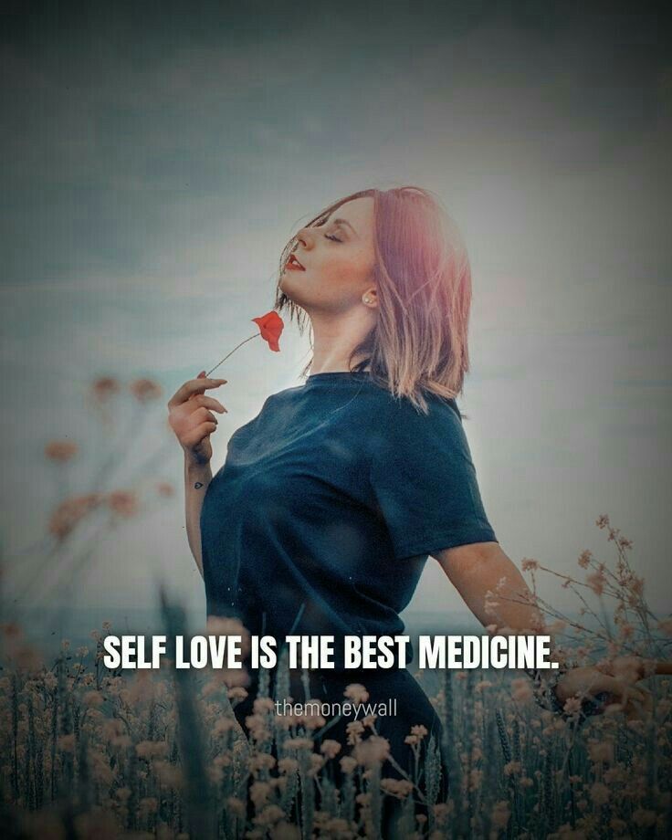 a woman standing in a field holding a flower with the words self love is the best medicine