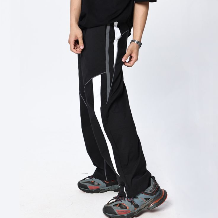 Take your fitness style to the next level with these Casual Functional Wide-leg Sweatpants. The wide-leg design encourages freedom of movement, while the lightweight, breathable fabric offers a comfortable fit. Take on your next challenge with confidence! Features: -80% Polyester, 20% Spandex -Mid-rise Waist -Drawstring Waistband -Stripe design -Regular Fit -Street Style Athleisure Wide-leg Sweatpants For Streetwear, Baggy Athleisure Yoga Pants, Black Straight Leg Sportswear Pants, Baggy Straight Sweatpants For Sports, Baggy Athleisure Activewear, Stretch Wide-leg Athleisure Joggers, Black Wide Leg Athleisure Joggers, Black Wide Leg Joggers For Athleisure, Sporty Stretch Wide-leg Parachute Pants