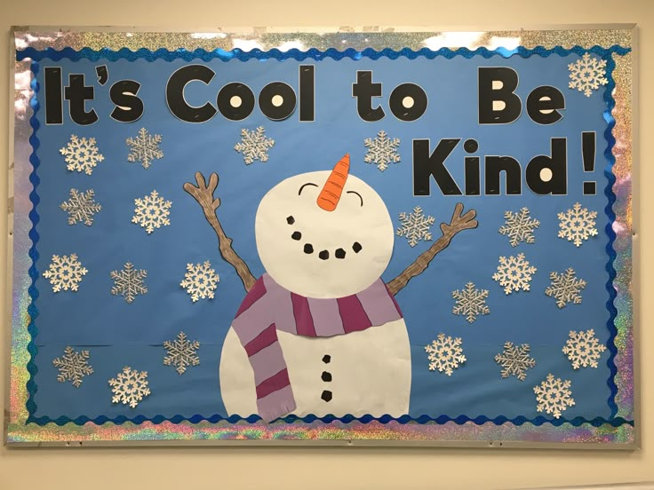 a bulletin board that says it's cool to be kind with a snowman