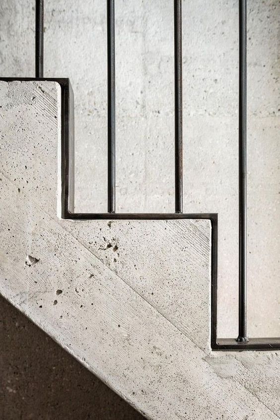 the stairs are made of concrete and metal