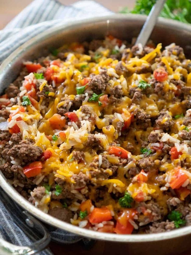 a casserole dish with meat, cheese and vegetables