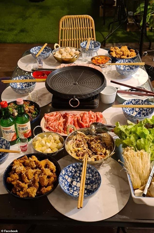 a table filled with plates and bowls full of food