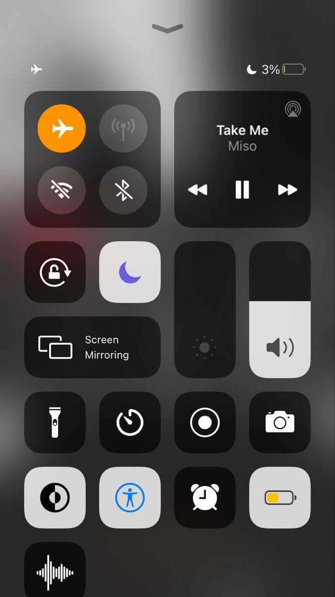 the control panel on an iphone with various buttons and icons in black, orange, white and grey colors