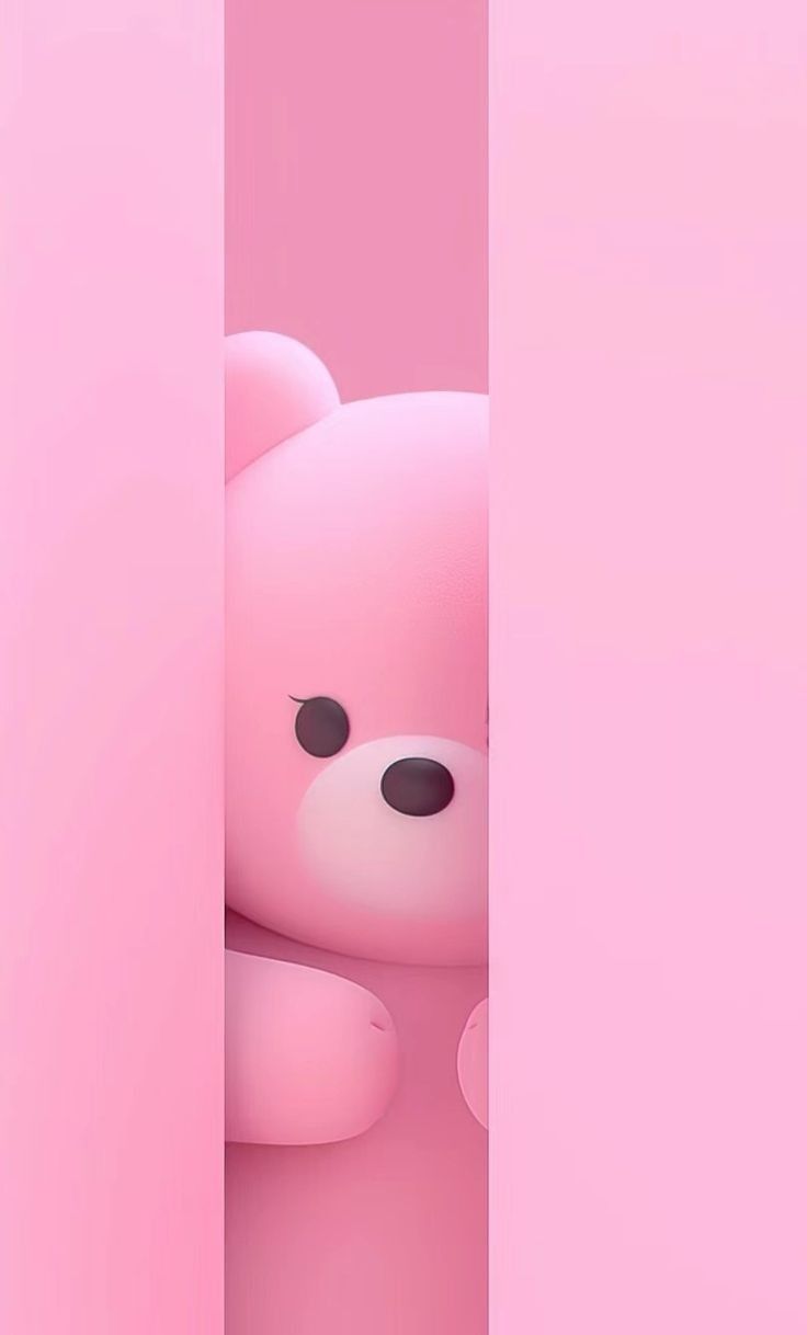 a pink teddy bear peeking out from behind a wall