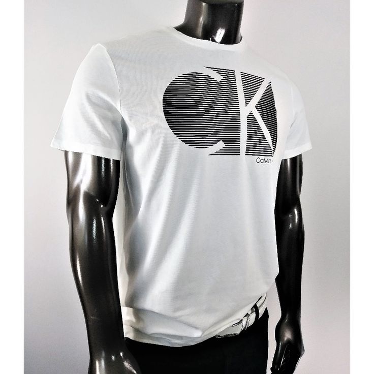 Calvin Klein White & Black Crew Neck Tee With Ck Logo Calvin Klein White Shirt For Spring, Calvin Klein Casual Tops For Streetwear, Casual Calvin Klein Tops For Streetwear, Casual Calvin Klein Tops With Logo Print, Calvin Klein Graphic Tee For Spring, Casual Calvin Klein Top With Logo Print, Sporty Calvin Klein Tops For Spring, Calvin Klein Sporty Tops With Relaxed Fit, Summer Calvin Klein Relaxed Fit Tops