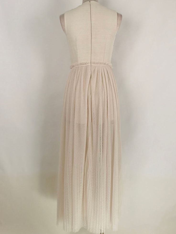 Casual style. Sleeveless. European design. Round neck. Open leg skirt. Pull on. Zipper down back closure. Sun front detail. Polyester fabric. Color may be lighter or darker depending of the device it is displayed. Beige Maxi Length Sleeveless Dress For Party, Beige Sleeveless Maxi Dress For Party, Sleeveless Beige Midi Dress With Pleated Bodice, Chic Beige Pleated Maxi Dress, Sleeveless Beige Midi Evening Dress, Elegant Maxi Dress With Back Zipper, Beige Pleated Maxi Dress For Party, Chic Cream Pleated Maxi Dress, Spring Evening Full-length Maxi Dress