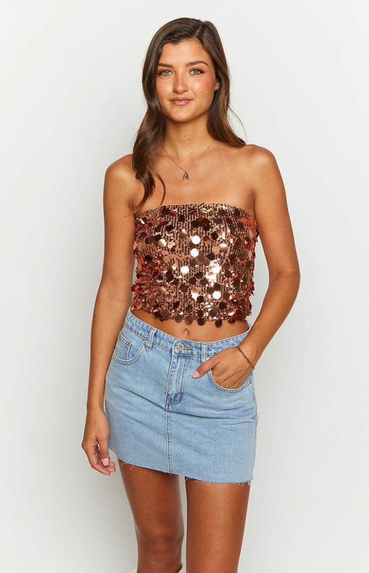 Bronze Sequin Strapless Crop Top

How to style: 
Never miss a chance to stand out in the Emiko sequenced crop top, the perfect top to make heads turn at a party. Pair this beautiful bronze crop top  ()with the matching Emiko bronze skirt () or mix it up with some basic white pants () and sneakers to create an effortless but confident look. 

Features: 
  
 * Lightweight material 
 * Strapless style 
 * Cropped length 
 * Fully lined 
 * Slight stretch 
 * Sequin material outer  
Please note: Due to delicate material sequins may fall off over time. Please be careful when handling garment. Glamorous Strapless Crop Top For Parties, Glamorous Sequined Crop Top For Date Night, Glamorous Crop Top For Party Season, Glamorous Spring Crop Top For Party, Glamorous Spring Party Crop Top, Strapless Sequined Crop Top For Party, Strapless Sequined Crop Top For Summer, Strapless Sequined Party Crop Top, Glamorous Sequined Summer Crop Top