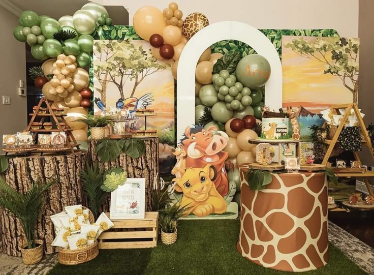 an animal themed birthday party with balloons and decorations