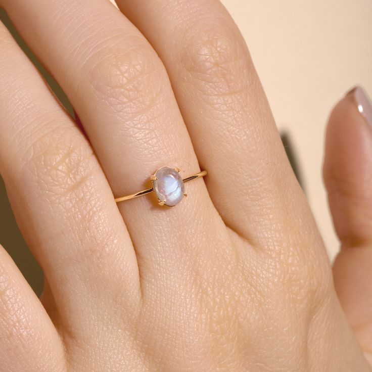 Moonstone Oval Cabochon Ring – STONE AND STRAND Dainty Rings With Natural Stones As Gifts, Dainty Rings With Natural Stones For Gift, 14k Gold Rings With Natural Stones For Gift, Delicate Handmade Oval Jewelry, Fine Jewelry Moonstone Ring With Natural Stones For Gift, Minimalist Oval Opal Ring For Gift, Minimalist Oval Opal Ring Gift, Dainty Natural Stone Rings For Anniversary, Dainty Natural Stone Promise Rings