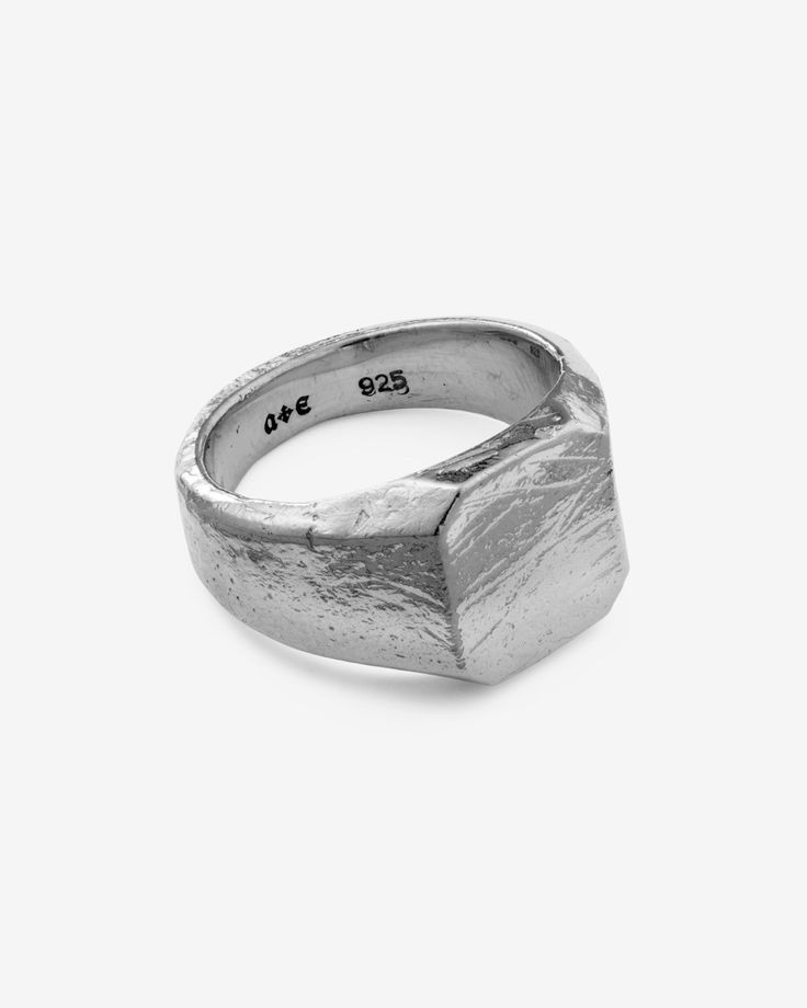 Latched onto the finger of a lucid luminary. Journeys etched with saged age, this ring is wrought with revelations of hidden dimensions, of destined designs. A 925 Sterling Silver signet ring surfaced with a time-worn texture. Bears an octagonal face. Demi-fine and forged for all genders and expressions. Sold individually. Each piece is lovingly crafted by hand, under ethical working conditions. Please allow for minor imperfections that are true to handcrafted jewelry. No two pieces are the same Modern Metal Signet Ring, Oxidized Finish Open Signet Ring, Symbolic Silver Signet Ring With Oxidized Finish, Luxury Symbolic Signet Ring With Oxidized Finish, Brutalist Sterling Silver Signet Ring, Thick Ring, Silver Signet Ring, Gold Signet Ring, Detailed Ring