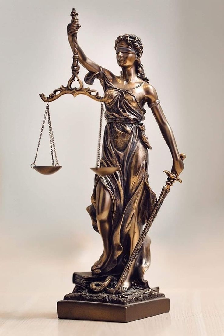 a statue of lady justice holding the scales of justice