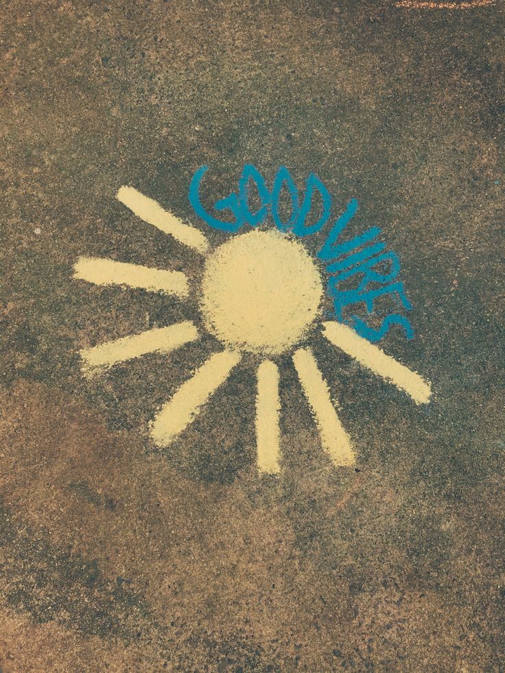 the sun is drawn on the ground with blue paint and white letters that spell out goodbye