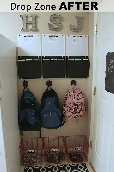 an entry way with some bags and backpacks hanging on the wall