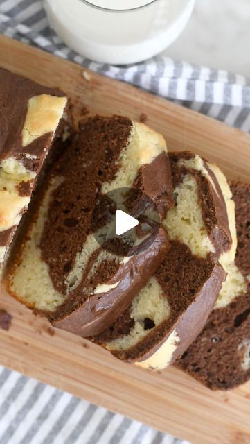 a loaf of chocolate swirl bread on a cutting board