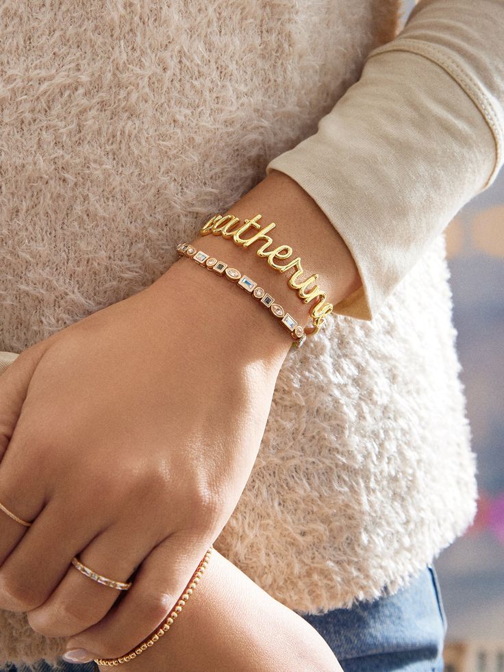 Orders placed between 12/1 - 12/11 will ship between 12/29 - 1/8.​ ​​ This classic cuff gets a modern update in our script font. Type out any personalization you please and your customization will appear in a pretty script font. The nameplate sits on an adjustable gold cuff. Please note: your customization will appear in all lowercase letters. Elegant Gold Jewelry With Custom Text, Elegant Gold Name Bracelet With Custom Text, Classic Customizable Name Bracelet, Elegant Adjustable Name Bracelet With Custom Text, Classic Customized Name Bracelet For Anniversary, Customized Classic Name Bracelet For Anniversary, Elegant Custom Text Name Bracelet Gift, Elegant Custom Text Name Bracelet, Personalized Cuff Bracelet As Gift