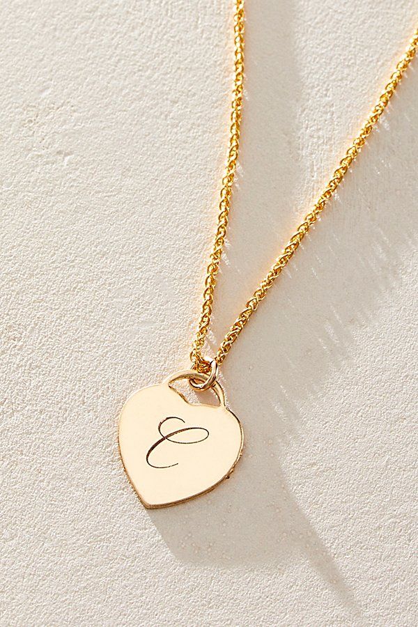 Just as effortless as it is elegant, this stunning necklace features a heart-shaped pendant with gorgeous cursive engraved initial for the ideal finishing touch. * 14k Gold Filled wheat chain * Personalized, laser engraved, 14k Gold Filled 12x14mm heart charm * Length: 18" * 5 days of production | Set & Stones Personalized Alice Necklace at Free People in Gold Elegant Engraved Nameplate Initial Necklace, Classic Heart Pendant Charm Necklace, Classic Engraved Charm Necklaces For Mother's Day, Elegant Heart Pendant Necklaces With Charms, Elegant Initial Pendant Necklace For Anniversary, Elegant Pendant Initial Necklace For Anniversary, Personalized Elegant Heart Pendant Name Necklace, Classic Engraved Initial Necklace For Mother's Day, Elegant Engraved Initial Necklace For Anniversary