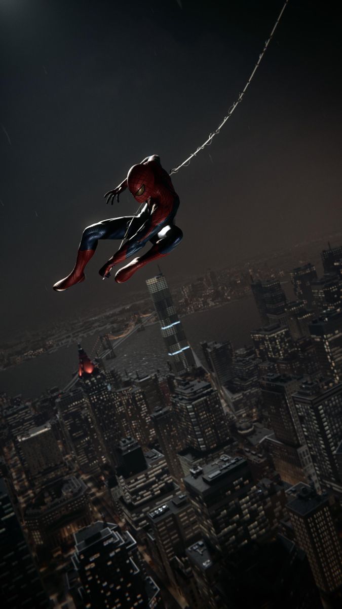 a spider man flying over the city at night