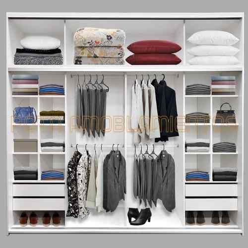 an organized closet with clothes and shoes