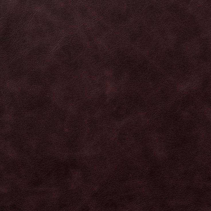 a brown leather textured background or wallpaper that looks like it has been used for many years