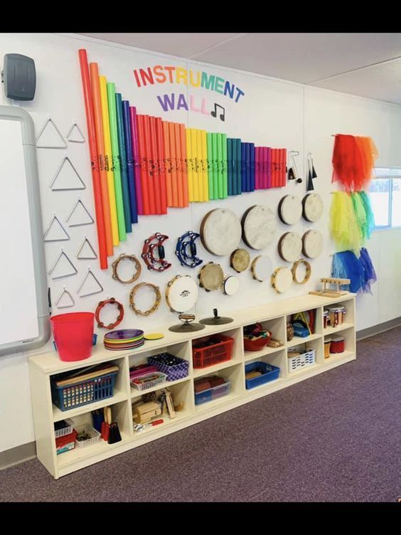 the wall is decorated with musical instruments and rainbows on it's wallshelves