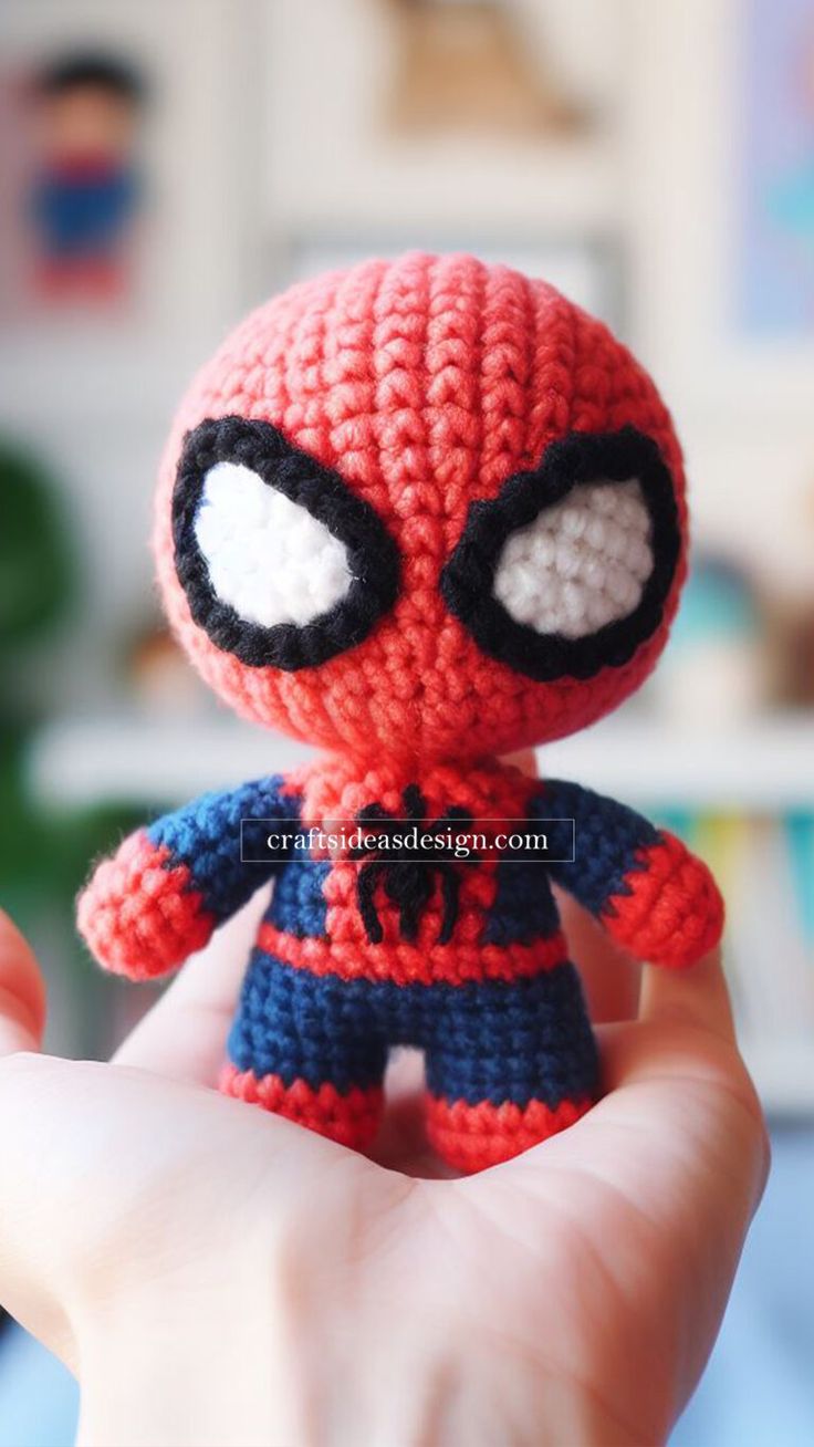 a crocheted spider - man doll with big eyes is shown in the foreground