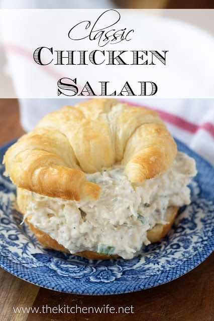 a chicken salad sandwich on a blue plate with the words classic chicken salad over it