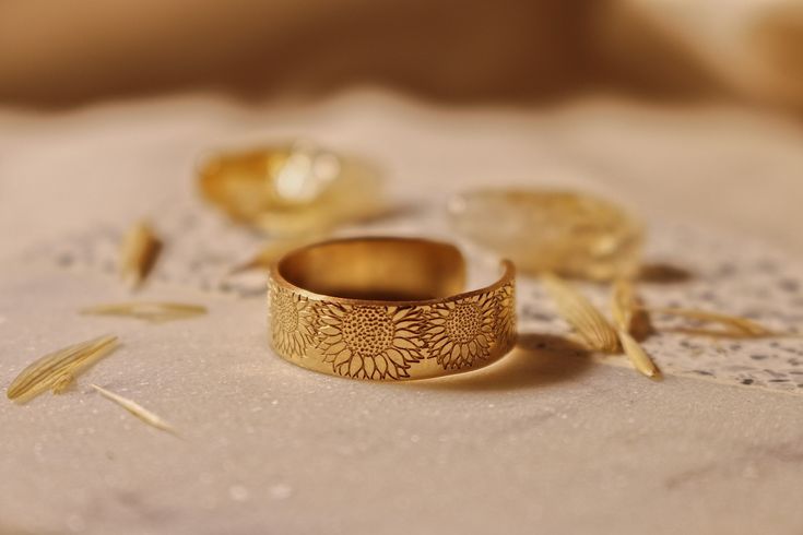 "Copy and paste into your browser, get 15% off ➔ https://bit.ly/VD15OFF Like wildflowers, you must allow yourself to grow in all the places people never thought you would. DETAILS: -Each ring is hand stamped -Ring is 14/20 Gold Filled -6mm in thickness You will receive one hand-stamped gold filled ring with no enamel filling. **Every item is handmade, this means that each will be unique and may not look EXACTLY like the picture, but it will look very similar ➡ORDER PROBLEMS If there are any prob Stamped Ring, Best Friend Birthday Gift, Hand Stamped Ring, Mystical Jewelry, Sunflower Ring, Friend Birthday Gift, Steel Stamp, Stamped Rings, Floral Jewelry