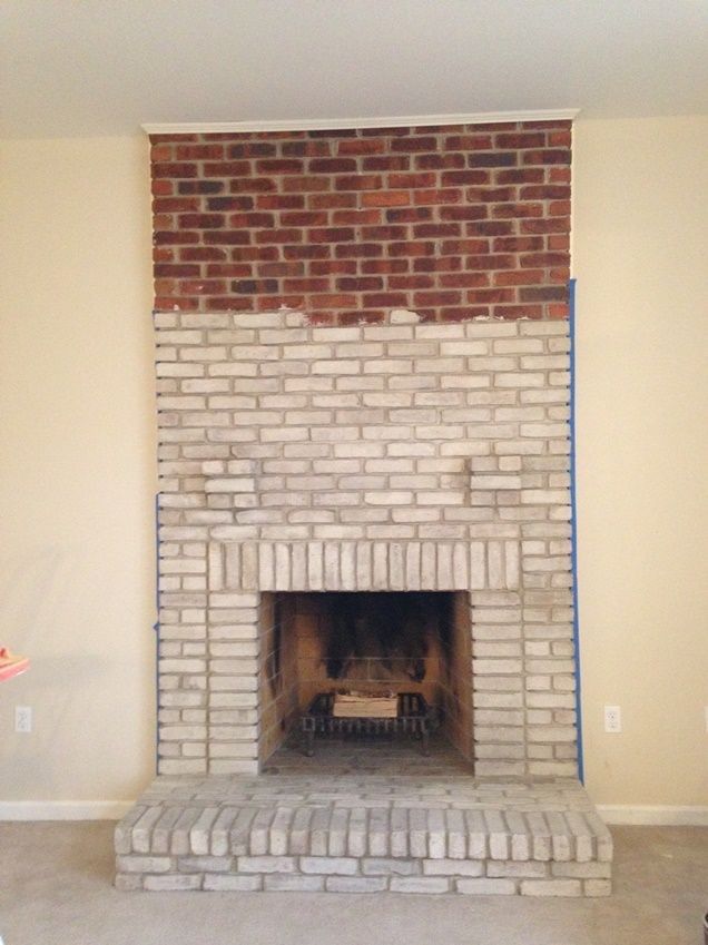 a brick fireplace is being installed in the living room