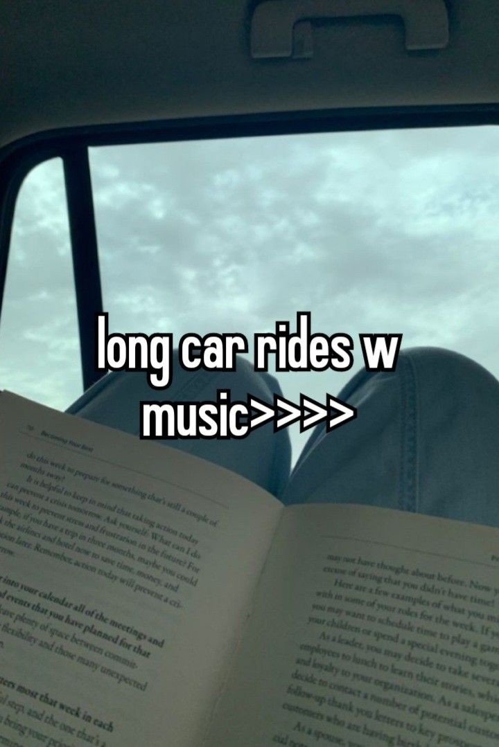 an open book sitting in the passenger seat of a car with text reading long car rides w music