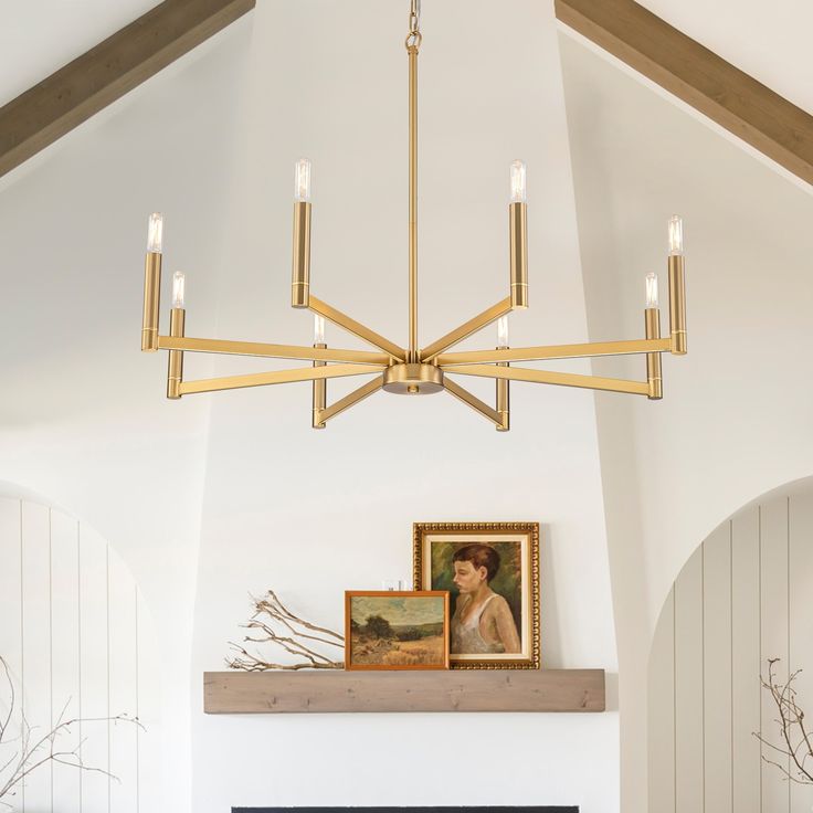 a living room with a fire place and a painting on the fireplace mantels