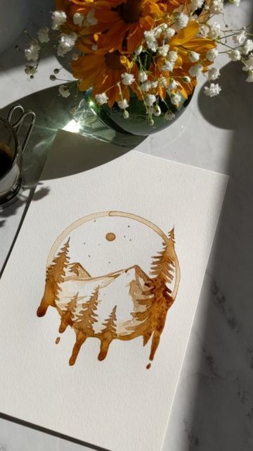 a paper with an image of two bears on it next to flowers and a cup of coffee