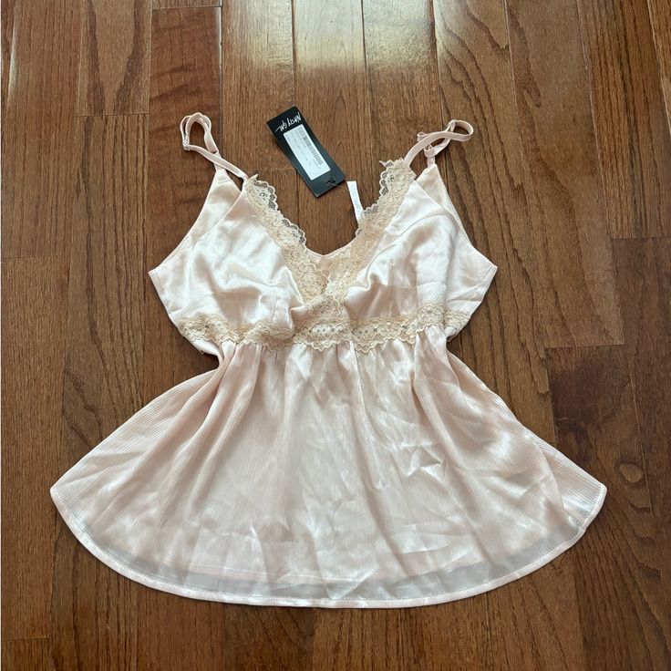 Nwt Nasty Gal Cream Colored Trim The Lights Satin Cami Top Out Of Stock Online! Brand: Nasty Gal In The Mood. This Cami Top Comes In Satin And Features A Relaxed Silhouette, V-Neckline With Lace Trim, Crochet Detailing Under Bust, And Adjustable Straps. It’s Super Soft And Very Cute And Flattering On Feminine Tops For Wedding Night In Spring, Feminine Spring Wedding Night Tops, Feminine Sleeveless Tops For Wedding Night, Sleeveless Top For Spring Wedding, Cami Top For Wedding Night In Summer, Sleeveless Tops For Wedding Night In Spring, Summer Wedding Night Cami Top, Feminine Lace Tops For Sleep, Feminine Lace Sleep Tops