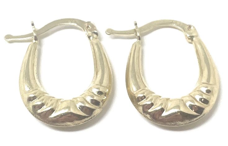 These 14k yellow gold oval hoop earrings are the perfect minimalist accessory. Wearable with anything, yet unique enough to be noticed, these oval hoops are the definition of modern and graceful. At just over under inch in height, these small sized hoops will make a subtle but lasting impression. Their simple yet stylish shape is sure to be in style for years to come. Available in a variety of styles, we are sure to have the unique oval hoops for you! Available in Classic, Twisted, Twisted Diamo Yellow Gold Oval Hoop Earrings, Classic Oval Gold-plated Hoop Earrings, Oval Yellow Gold Plated Hoop Earrings, Gold Brass Oval Hoop Earrings, Oval 14k Gold Tarnish-resistant Hoop Earrings, Minimalist Accessories, Gold Hoop, Gold Hoop Earrings, Diamond Cuts