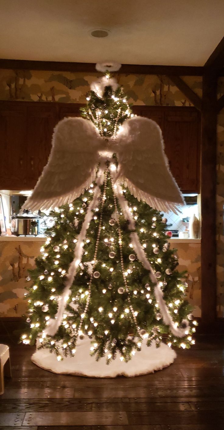 a christmas tree with angel wings on it