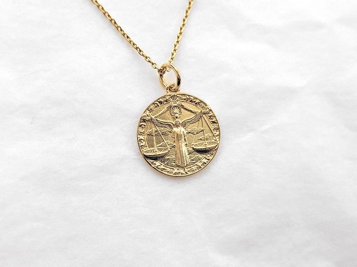 women's 14k 18k gold zodiac libra necklace pendant libra is the seventh astrological sign in the zodiac. the sun transits this sign on average between sep 23 and oct 23. all features with exquisite details are related to libra. - this pendant diameter is 19mm without the bail. - materials: real 14k solid gold, real 18k solid gold - model wears a 1.4mm 50cm. - free shipping on all orders - made in south korea 14k gold zodiac libra pendant necklace weight pendant only 3.24g (±3%) with a 1.2mm 42cm 14k Gold Zodiac Sign Medallion Jewelry, Yellow Gold Zodiac Sign Coin Pendant Necklace, Yellow Gold Coin Pendant Necklace With Zodiac Sign, Libra Pendant, Libra Necklace, Libra Zodiac, Gold Necklace Women, Gold Models, Mens Pendant