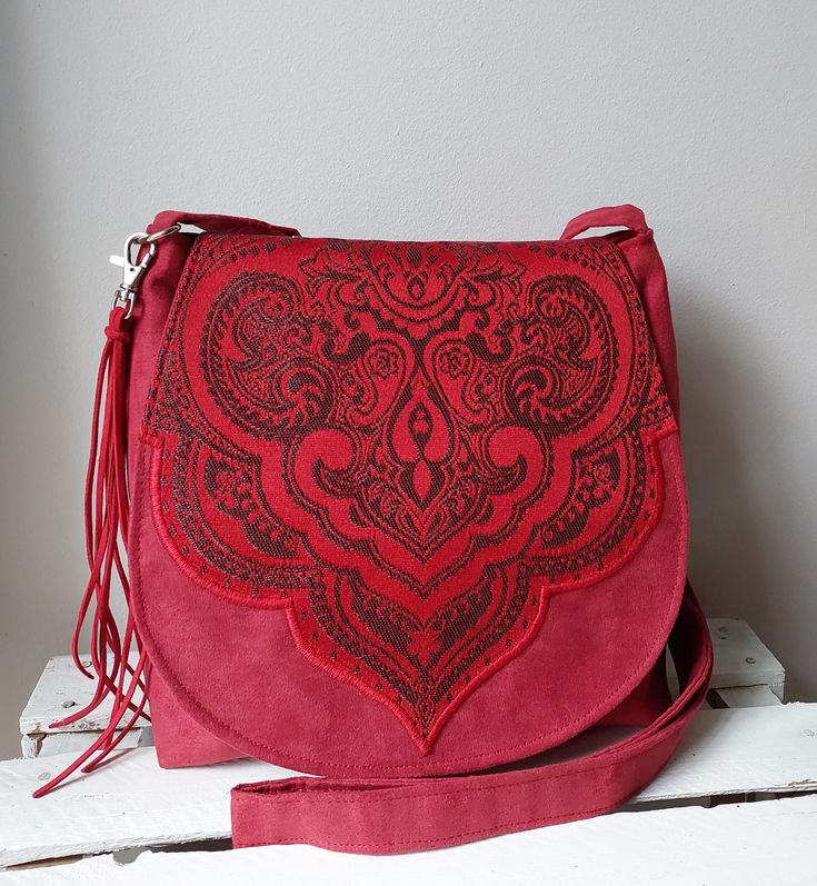 Red crossbody bag Oriental bag  All day carry bag Eco friendly bag Womens gift idea Ethical fashion Boho bag Gift for her Artisan bag Original stylish bag decorated with oriental pattern. Exceptional gift for admirers of the style boho 🔴 Bag made of and vegan suede and jacquard, 🔴 Inside the bag will find a lining with two pockets. 🔴 Bag closed by magnetic snap. 🔴 For wearing on a shoulder or diagonally with adjustable, long strap. 🔴 The flap of the bag is decorated with an original badge. Handmade Burgundy Bag For Daily Use, Handmade Burgundy Shoulder Bag For Daily Use, Red Everyday Bag For Mobile Phone, Red Everyday Mobile Phone Bag, Red Mobile Phone Bag For Everyday Use, Red Pouch Shoulder Bag As Gift, Red Shoulder Bag With Mobile Phone Holder As Gift, Handmade Burgundy Shoulder Bag For Everyday, Red Shoulder Bag For Gift