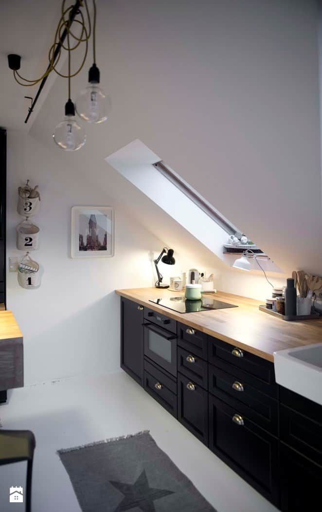 an image of a kitchen with skylights in the ceiling and light fixtures on the wall