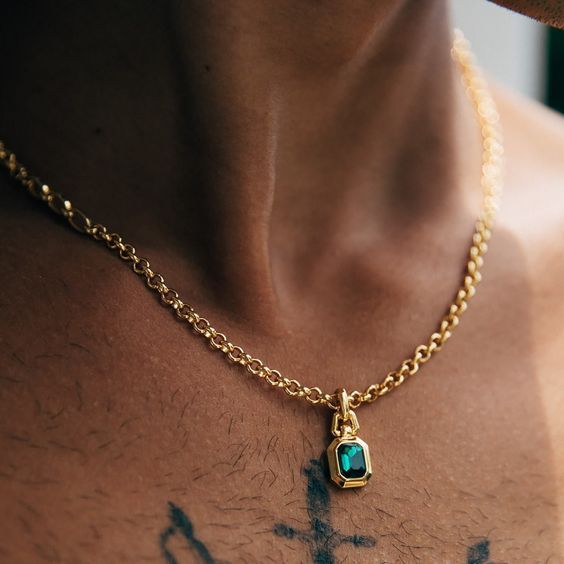 The one you didn't know you've been searching for. This necklace was created with versatility in mind, with a mix of two chains giving it a contemporary twist. Abel has a mix of 2 different gold chain styles, delicately finished off with our signature emerald pendant. All of our 18k gold or silver plated jewellery should be stored in a cool, dry place and cleaned carefully with a soft non-abrasive cloth to maintain shine.Our pieces also contain real glass stones, cubic zirconia or freshwater pea Emerald Pendant Men, Mens Necklace Gold Pendant, Emerald Pendant For Men, Emerald Jewelry For Men, Man Necklace Aesthetic, Gold Pendant Jewelry With Cable Chain, Tarnish Resistant Brass Pendant Chain Necklace, Gold Plated Emerald Necklace Fine Jewelry, Fine Jewelry Gold Emerald Necklace With Delicate Chain