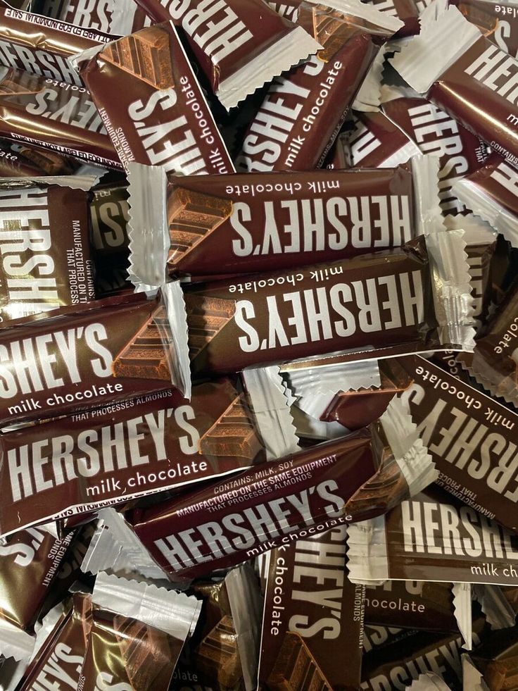 hershey's chocolate bars are stacked on top of each other in a pile