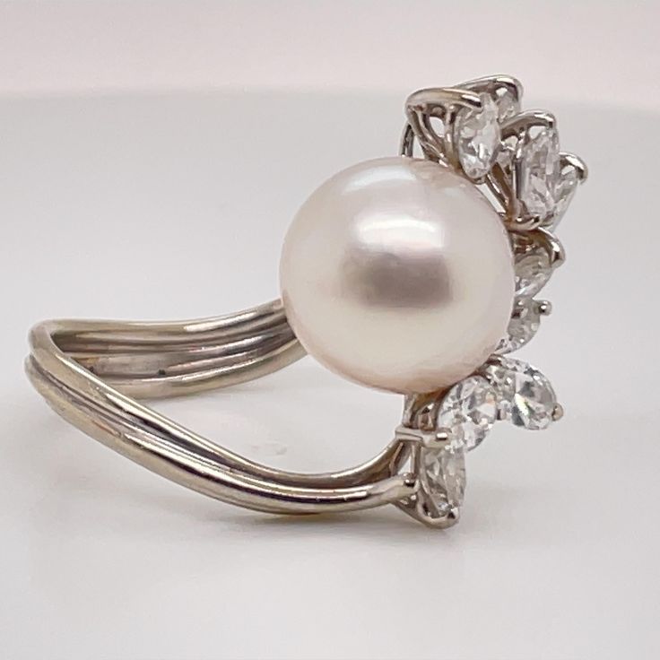 Elegant Oval Brilliant Cut Pearl Ring, Elegant Oval Pearl Ring With Brilliant Cut, Classic Oval Pearl Ring With Diamond Accents, Timeless Oval Pearl Ring With Brilliant Cut, Luxury Oval Pearl Ring With Brilliant Cut, Oval Diamond Pearl Ring For Anniversary, Oval Diamond White Pearl Ring, Oval Diamond White Pearl Ring With Diamond, Classic Oval Diamond Pearl Ring