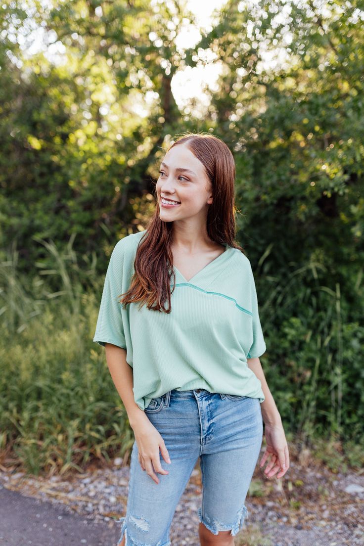 *ALL SALES FINAL* *NOT ELIGIBLE FOR RETURN* Introducing the Catherine Top! With a fresh mint green color and ribbed texture, this top is both oversized stylish and comfortable. The wide v-neck front and back add a touch of elegance, while the drop shoulder short sleeves keep it relaxed. Perfect for any occasion. Fits true to size. Model is wearing a small and is 5'6". Plus model is wearing a 1X and is 5'7". Size Chart Length Bust S 27" 58" M 28" 60" L 29.5" 62" XL 31.5" 64" 2x 31.5" 67" 3x 31.5" Casual Solid Color V-neck Top For Spring, Trendy Green V-neck Top, Oversized V-neck Top In Solid Color, Green V-neck Casual Top, Oversized Green Chic Top, Oversized Chic Green Top, Oversized Green V-neck Top, Oversized Solid Color V-neck Top, Oversized Solid V-neck Top