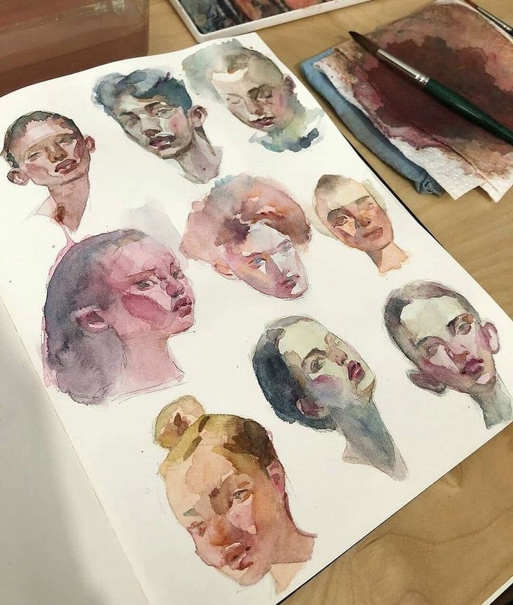 watercolors are being used to paint portraits of men's heads on paper