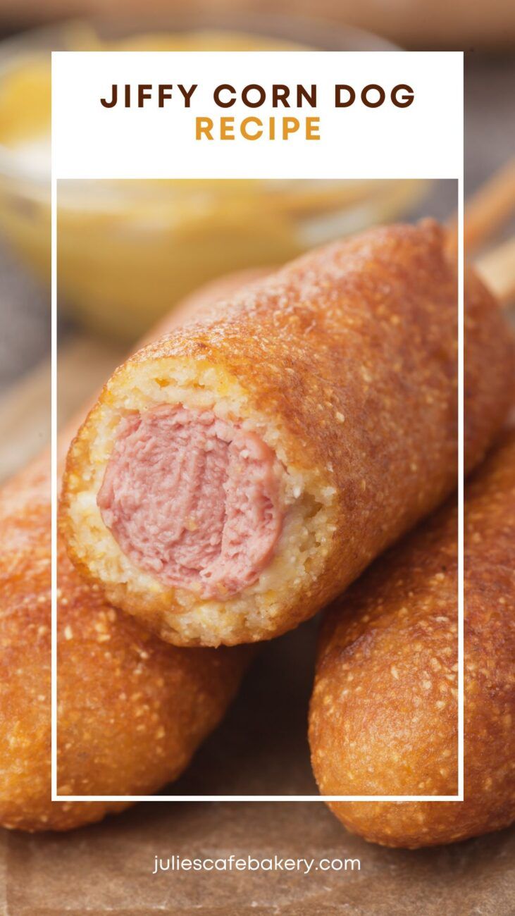 two sausage rolls on a cutting board with dipping sauce in the background and text overlay that reads, jiffy corn dog recipe