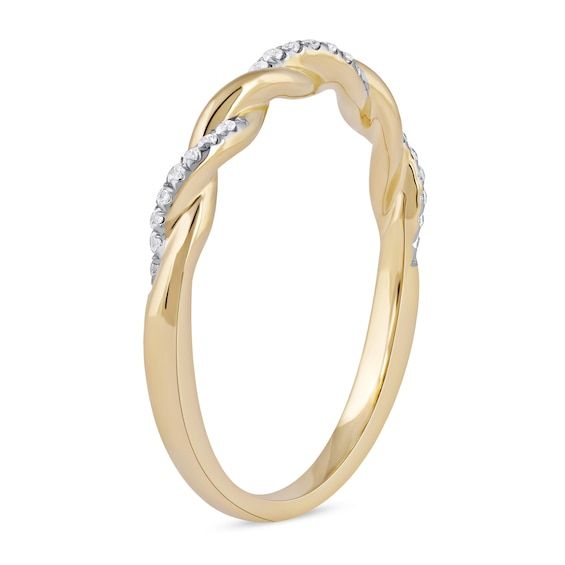 An elegant classic, this diamond twist band in yellow gold is a must-have look for your collection of stackable rings. Created in warm 10K gold Polished and diamond-lined ribbons shimmer in a timeless twist design. This band shines with 1/10 ct. t.w. of diamonds. Modern Twist Diamond Stackable Rings For Anniversary, Modern Twist Yellow Gold Diamond Ring For Formal Occasions, Modern Twist Yellow Gold Diamond Ring, Elegant Twisted Anniversary Rings, Gold Diamond Ring For Anniversary With Modern Twist, Modern Twist Gold Diamond Ring For Anniversary, Modern Twist Yellow Gold Rings With Diamond Accents, Modern Twist Yellow Gold Diamond Ring For Anniversary, Anniversary Yellow Gold Diamond Ring With A Modern Twist