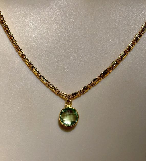 This gorgeous Italian gold scroll chain is made of 24k gold fill and is nickel and lead free. This is Dayna Kathan's third necklace in her Reunion 8 look.  The bezel pendant is a light green amethyst stone.DAYNA WEARS THE 17 inches length in Reunion 8.*There are several sizes available.**This necklace does not come with an extension chain.***Photos 2,5 and 6 are paired with other necklaces from Dayna's Reunion look. Gold Gemstone Round Chain Necklace, Gold Gemstone Chain Necklace, Yellow Gold Gemstone Chain Necklace Gift, Gold Chain Necklace With Round Gemstone, Elegant Gold Birthstone Necklace In Recycled Gold, Gold Spiritual Jewelry With Cable Chain, Formal Gold Chain Necklace With Gemstone, Gold Gemstone Necklace For May Birthstone, Gold Birthstone Necklace With Cable Chain For Gift