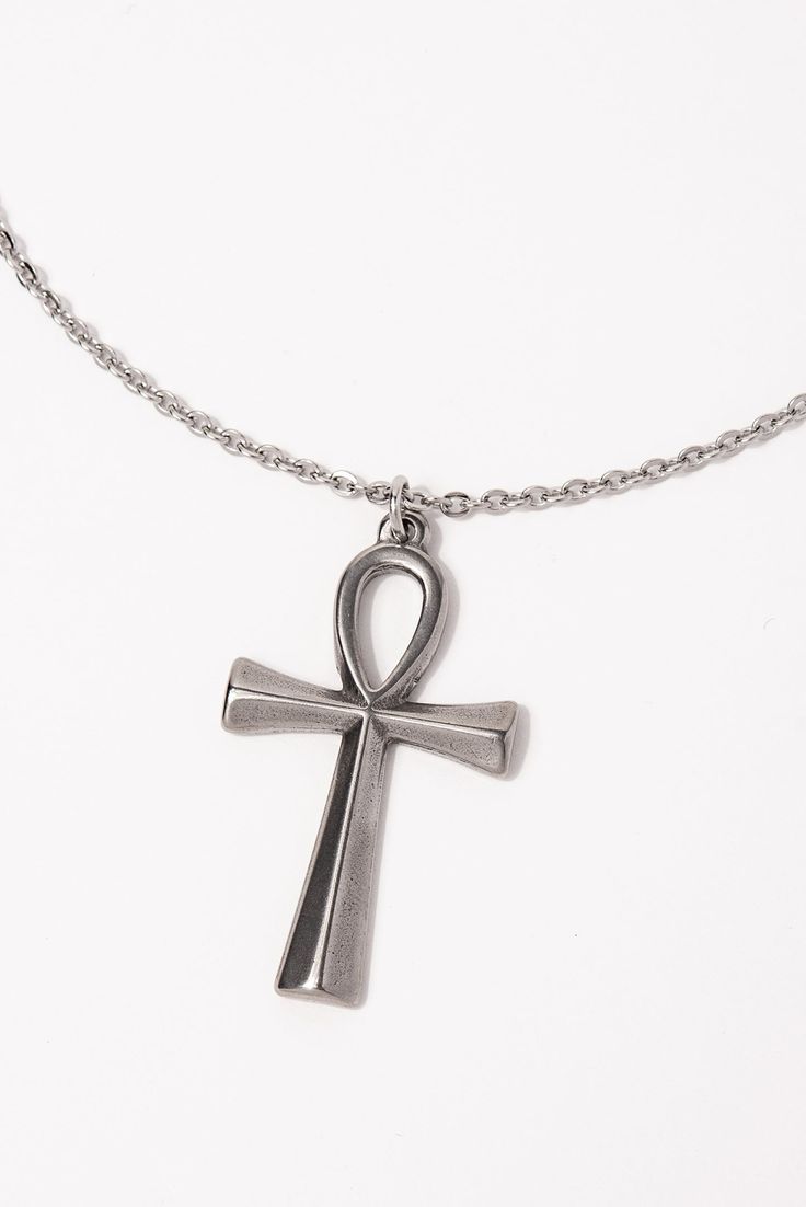 This Stainless Steel Chain Necklace with Ankh Pendant is the perfect blend of style and ancient symbolism. The Ankh pendant, an ancient Egyptian symbol of life, adds a touch of spirituality and cultural significance to this necklace. Whether you're looking to make a fashion statement or simply want to add a meaningful accessory to your collection, this necklace is a great choice. Plus, with its affordable price and versatile design, it makes a great gift for any friend or loved one. Size Length: Spiritual Ankh Necklace With Adjustable Chain, Spiritual Metal Cross Necklaces, Symbolic Ankh Necklace Adjustable, Symbolic Ankh Necklace, Symbolic Ankh Shaped Metal Jewelry, Symbolic Ankh-shaped Metal Jewelry, Symbolic Metal Cross Necklace, Ankh Shaped Metal Necklace As Gift, Ankh Shaped Metal Necklace For Gift