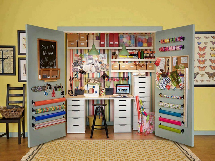 a room with lots of crafting supplies on the wall and shelves in it,