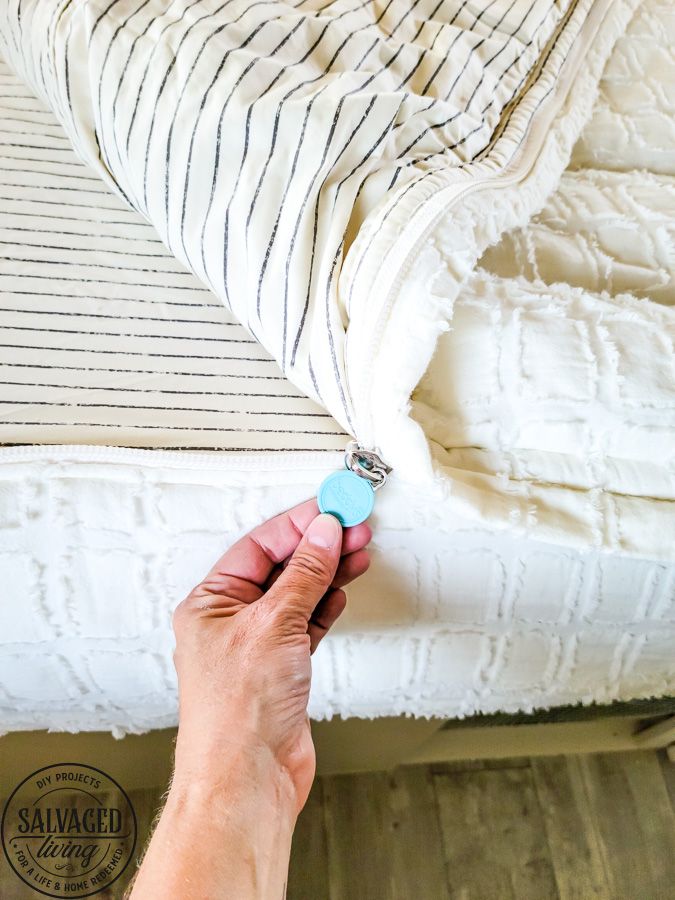 a person is holding a key to a mattress