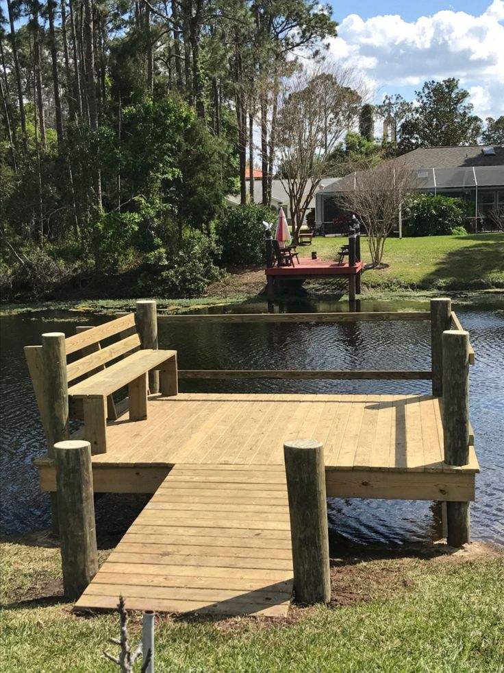 a wooden dock sitting next to a body of water