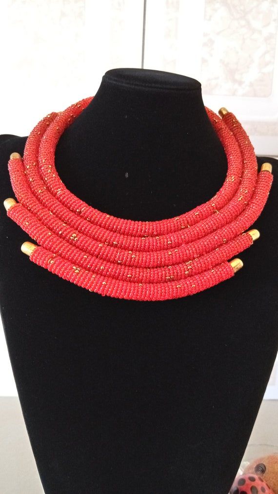 African Red Statement Necklace, African Beaded Layered Necklace, African Jewelry, Masai Necklace, Tribal Necklace, Gift For HerThis beaded layered necklace is superbly crafted which can be worn with any outfit at different occasions.Main color - Red.The necklace can be available in different colors.Wholesale available at a fair price,please contact me.For any clarification,please send me a convo or an e-mail.Thank you for visiting and happy shopping!!.. Handmade Red Beaded Choker Necklace, Handmade Red Bib Necklace For Party, Elegant Red Beaded Choker, Red Multi-strand Beaded Necklace, Red Beaded Bib Necklace, Red Bib Necklace With Colorful Beads For Gift, Red Jewelry With Gold Beads For Jewelry Making, Red Party Beaded Necklaces With Gold Beads, Elegant Red Beaded Bib Necklace